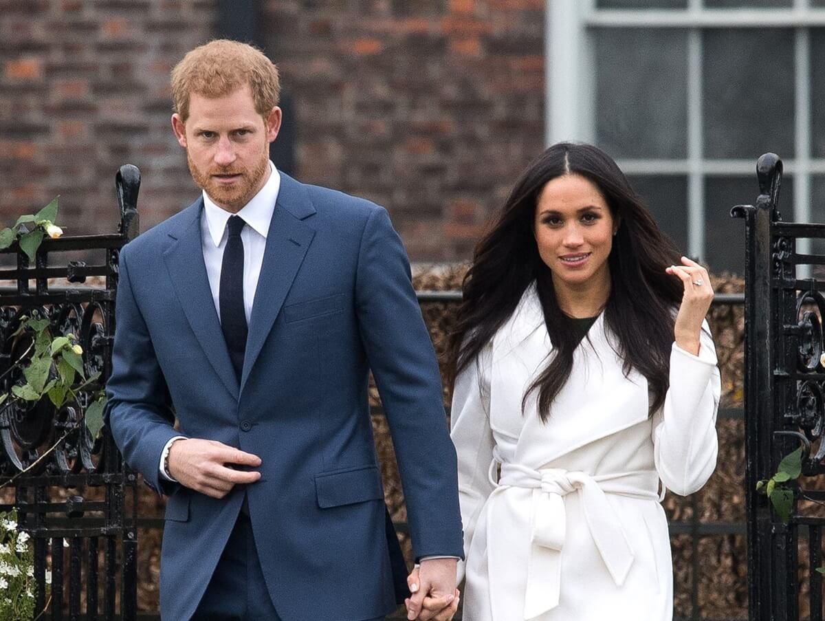 Prince Harry and Meghan Markle attend a photocall in the Sunken Gardens at Kensington Palace following the announcement of their engagement