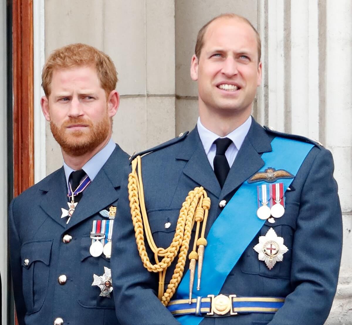 Prince Harry and Prince William watch a flypast from the balcony of Buckingham Palace