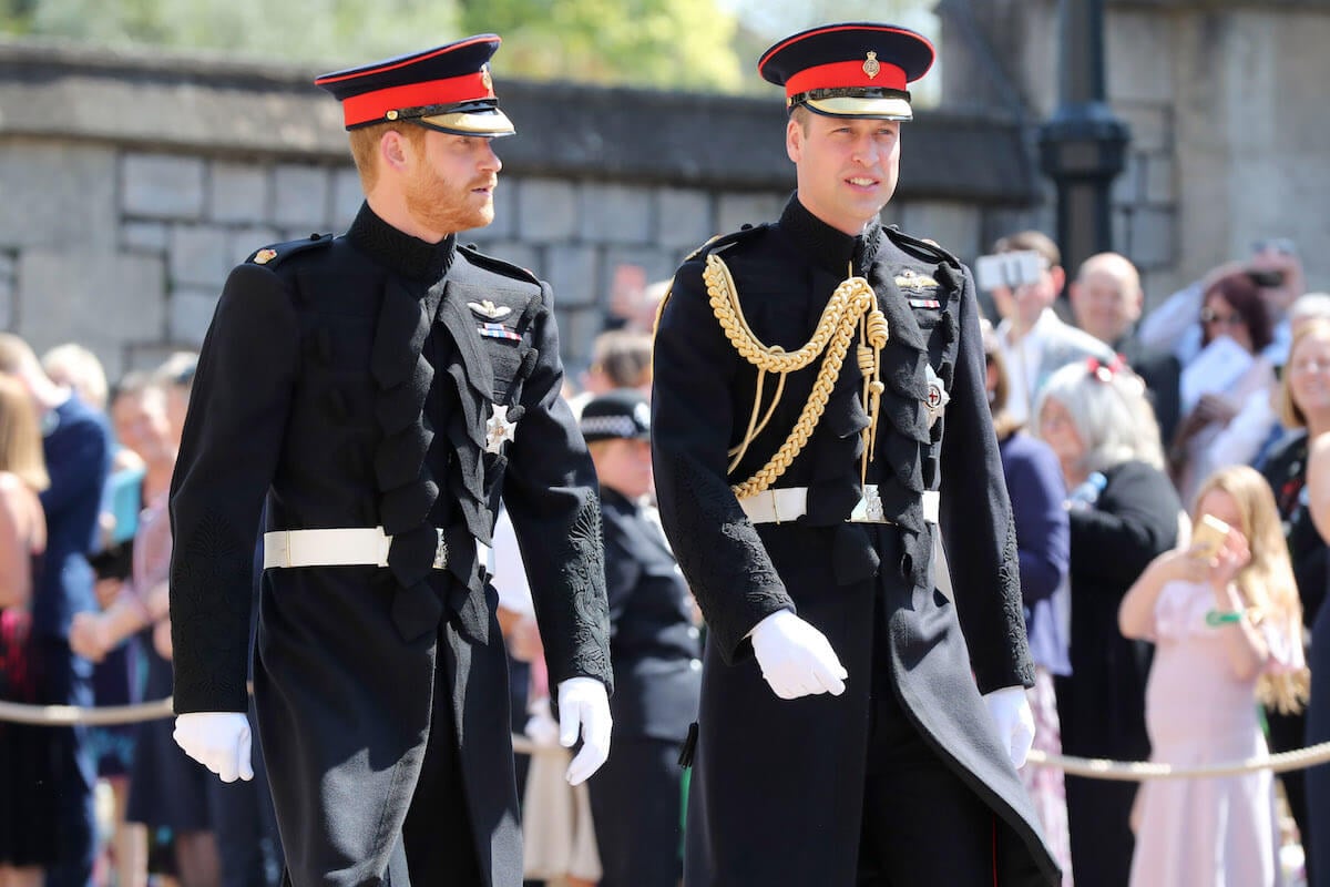 Prince Harry, who feared Prince William would shave his beard at his 2018 bachelor party, walks with his brother outside Windsor Castle at his royal wedding to Meghan Markle