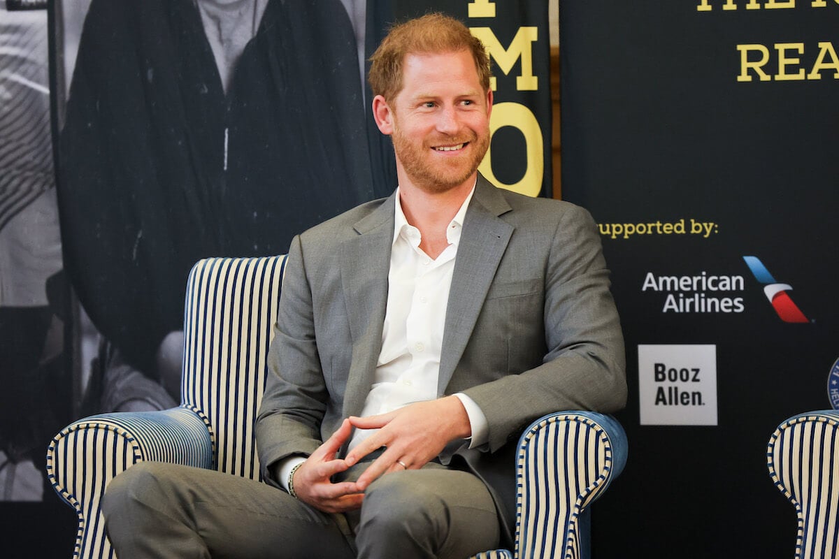 Prince Harry, who will have no family at the Invictus Games anniversary service, in London, England, sitting in a chair wearing a gray suit.