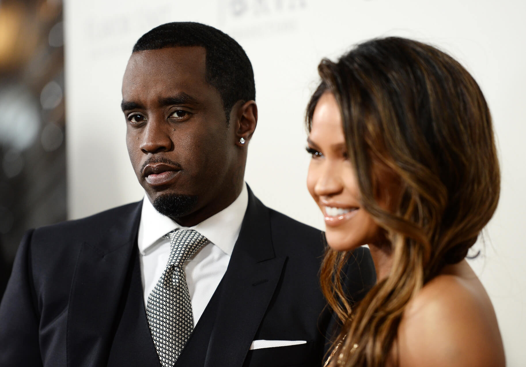 Sean 'P. Diddy' Combs next to Casandra 'Cassie' Ventura, who is laughing, in 2016 at a movie premiere