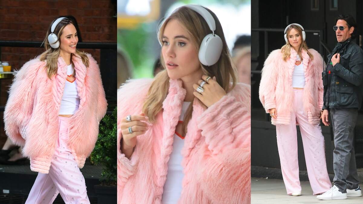 Actor/singer Suki Waterhouse wears a fluffy pink coat and walks down a street in NYC