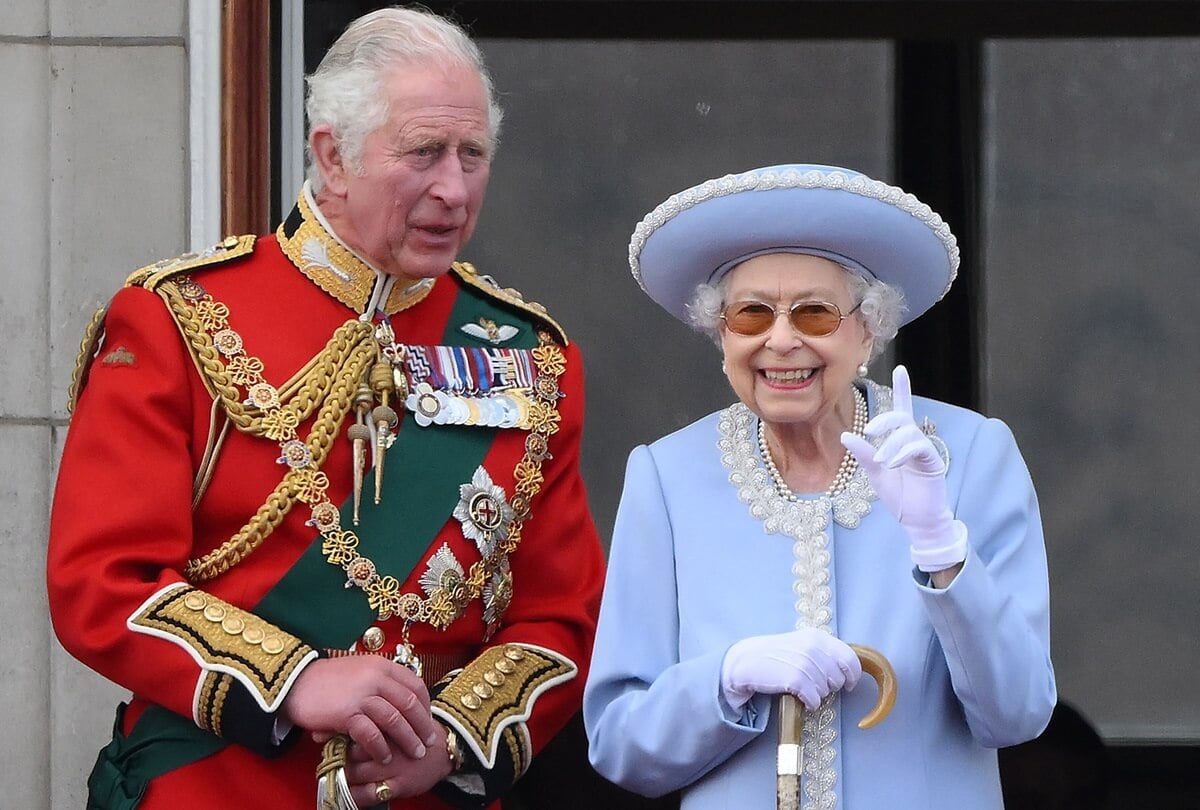 Then-Prince Charles and Queen Elizabeth II standing on the balcony of Buckingham Palace during Trooping the Colour