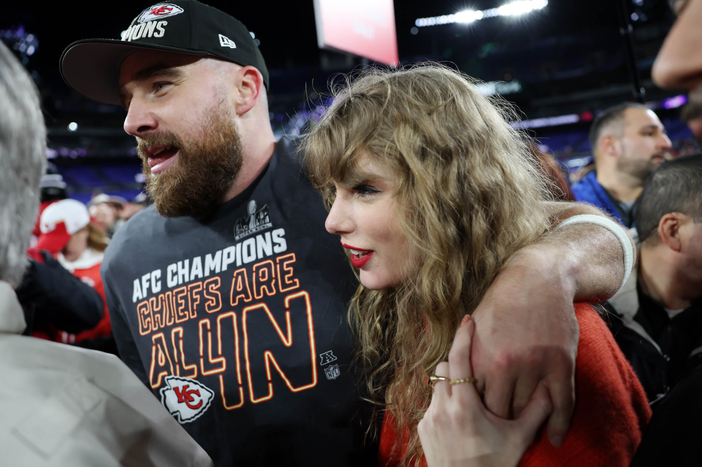 Travis Kelce with his arm around Taylor Swift after a game with the Kansas City Chiefs