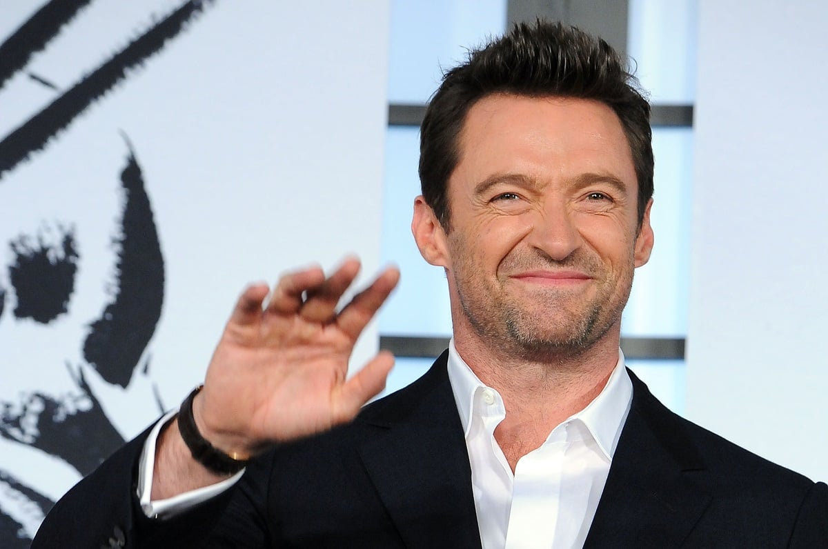 Hugh Jackman posing in a suit at the premiere of 'The Wolverine'.