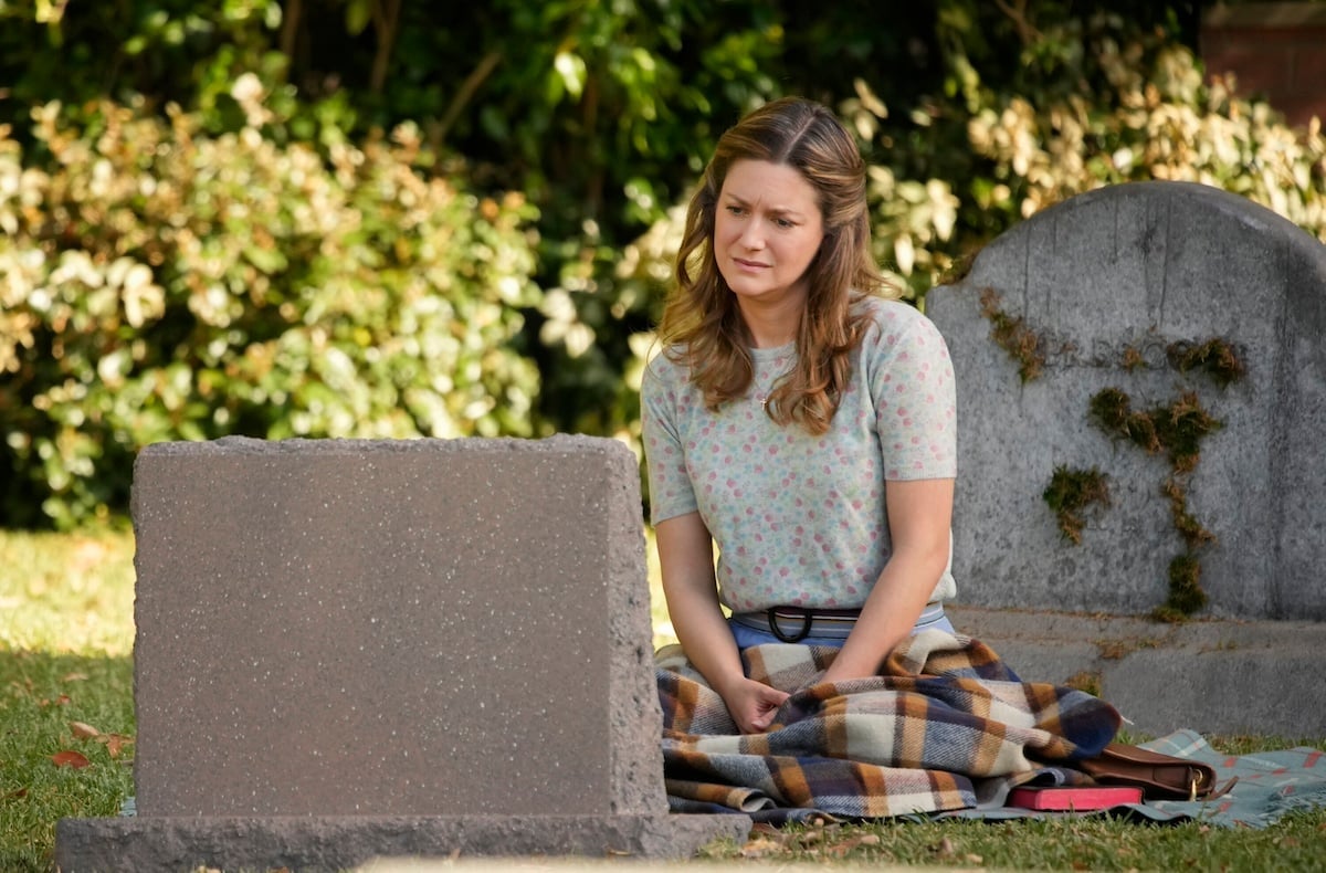 Mary sits in front of George Sr.'s headstone in the 'Young Sheldon' series finale