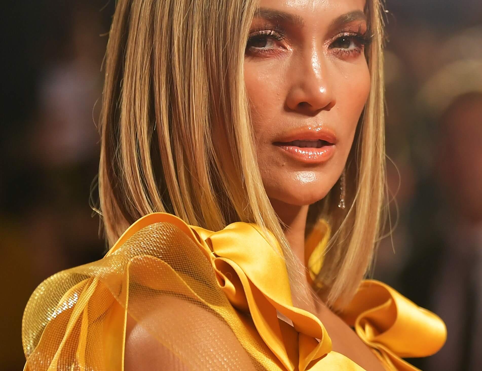 Jennifer Lopez wearing gold clothing