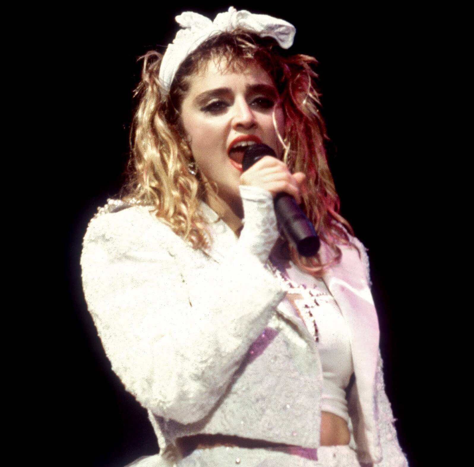 "Material Girl" singer Madonna with a microphone