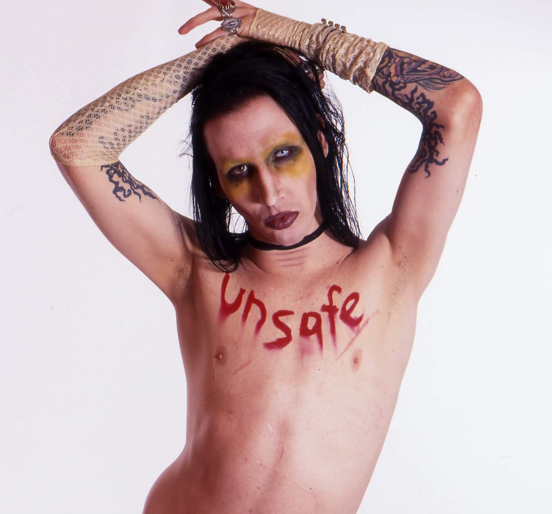 Marilyn Manson with his hands above his head