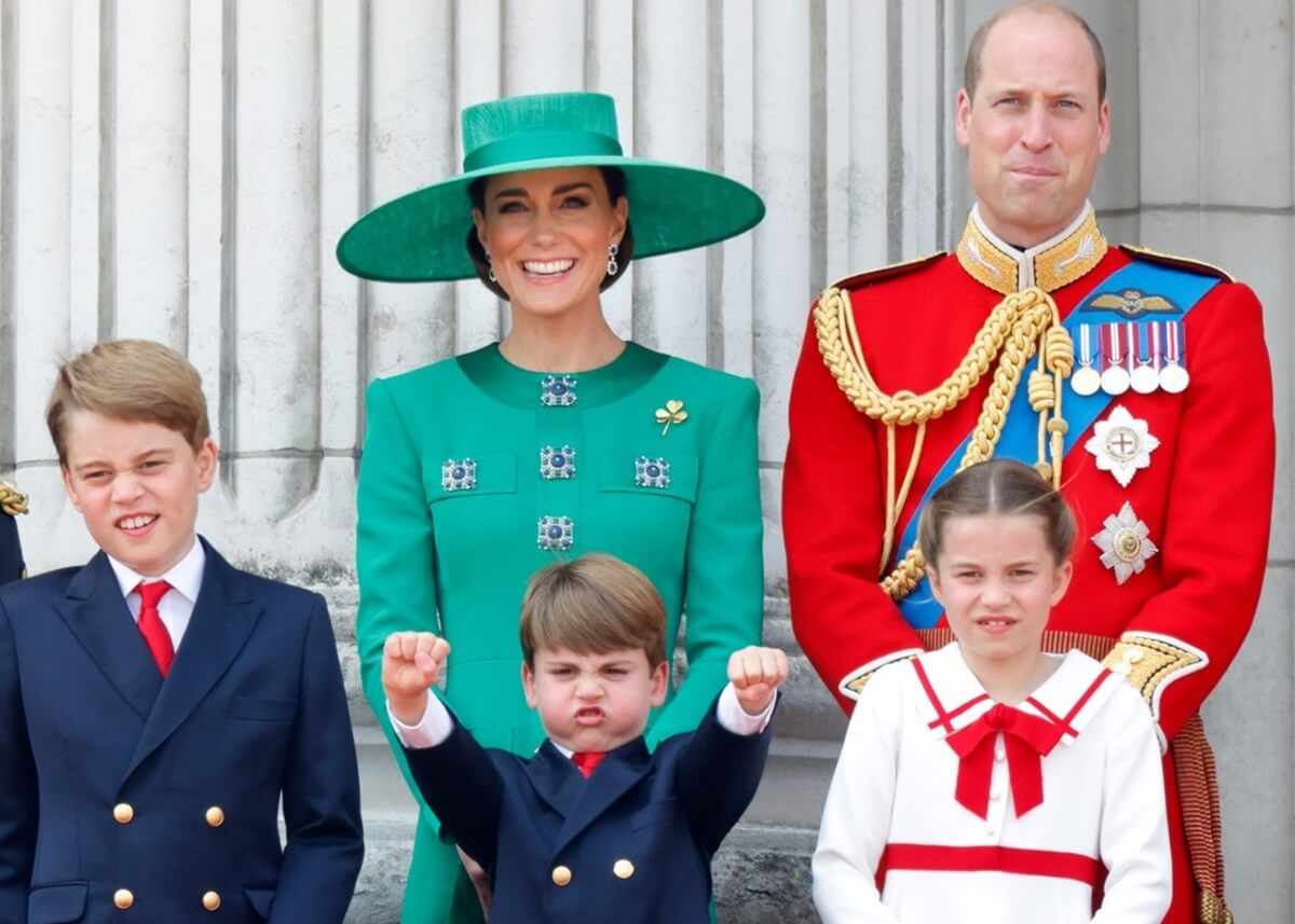 Kate Middleton and Prince William watch a flypast with Prince George, Princess Charlotte, and Prince Louis during Trooping the Colour