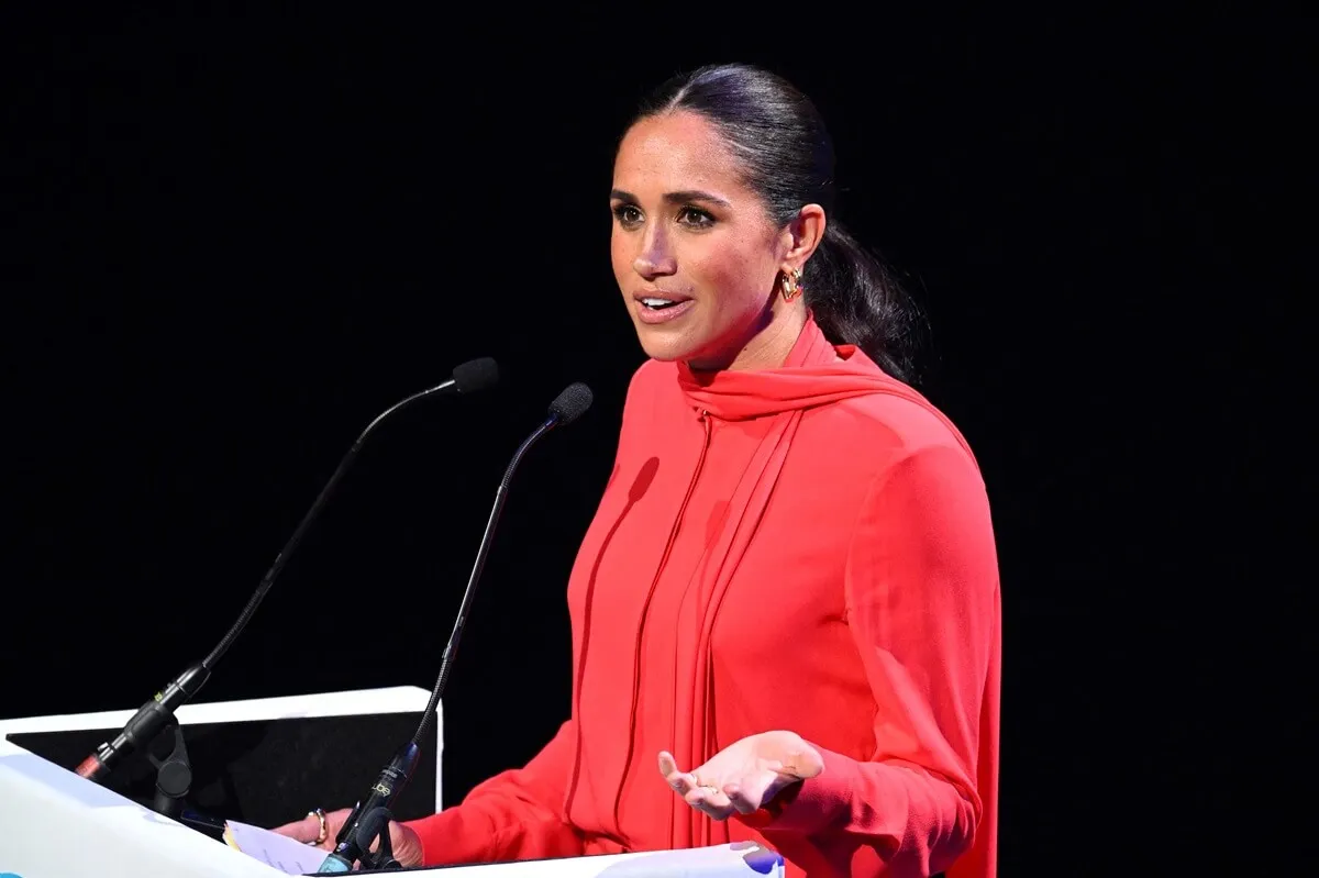 Meghan Markle delivers a speech on stage during the annual One Young World Summit In Manchester, England