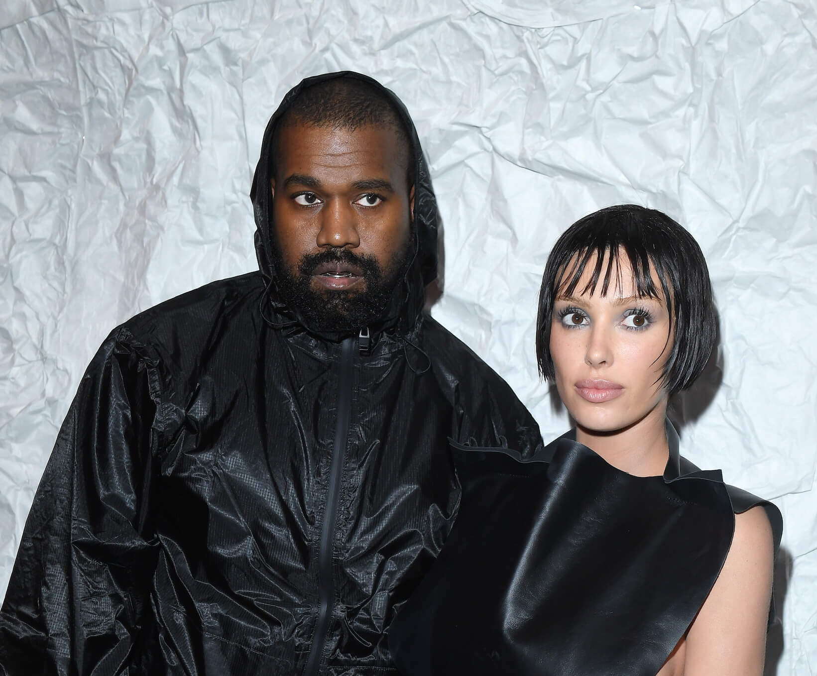 Kanye West and Bianca Censori dressed in black and posing