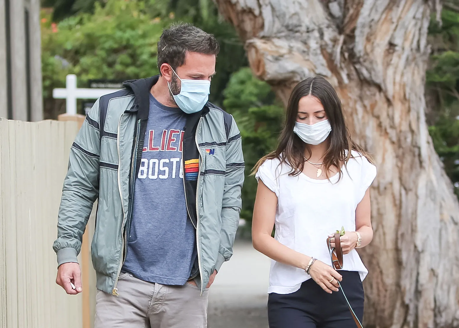 Ben Affleck and Ana de Armas walking in LA in July 2020. They're wearing masks.