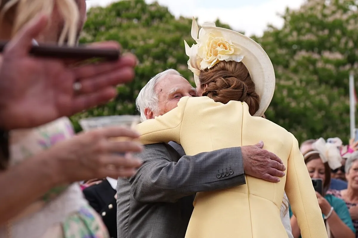 Kate Middleton hugs Holocaust survivor, Steven Frank, during a Royal Garden Party at Buckingham Palace