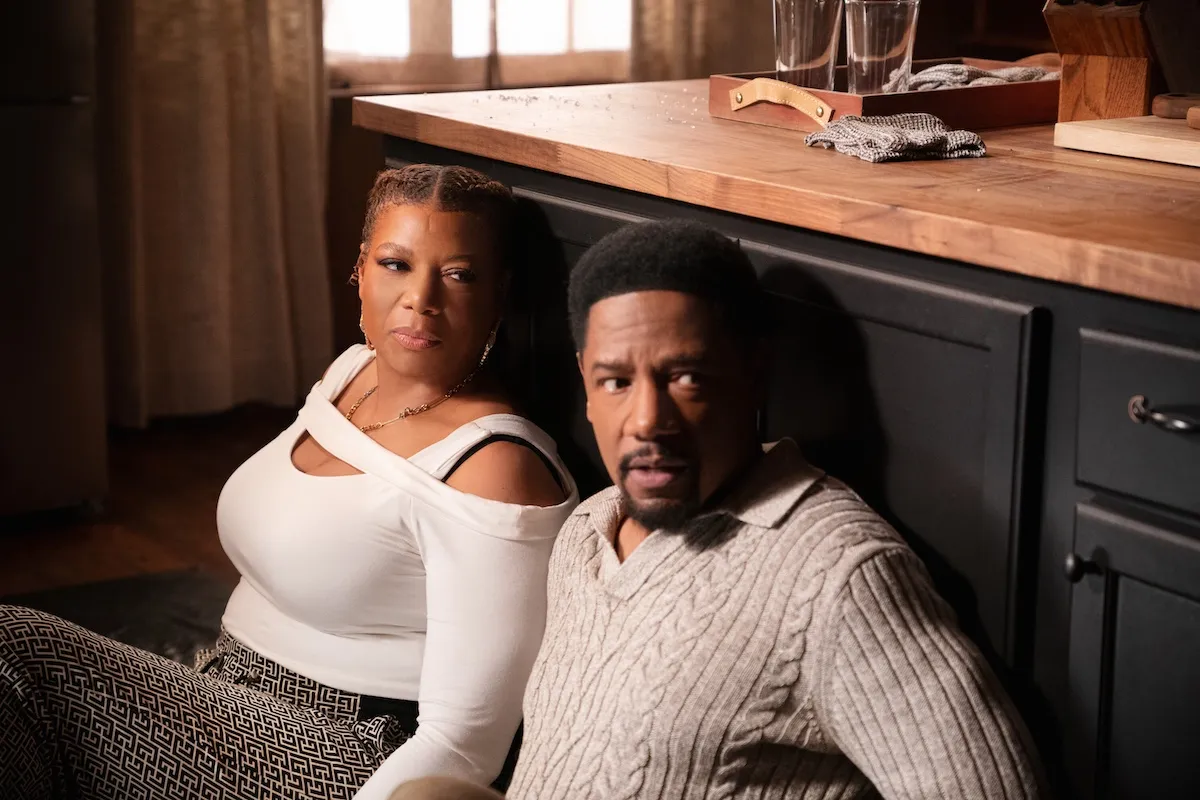 McCall and Dante crouched next to a kitchen island in 'The Equalizer' Season 5 finale
