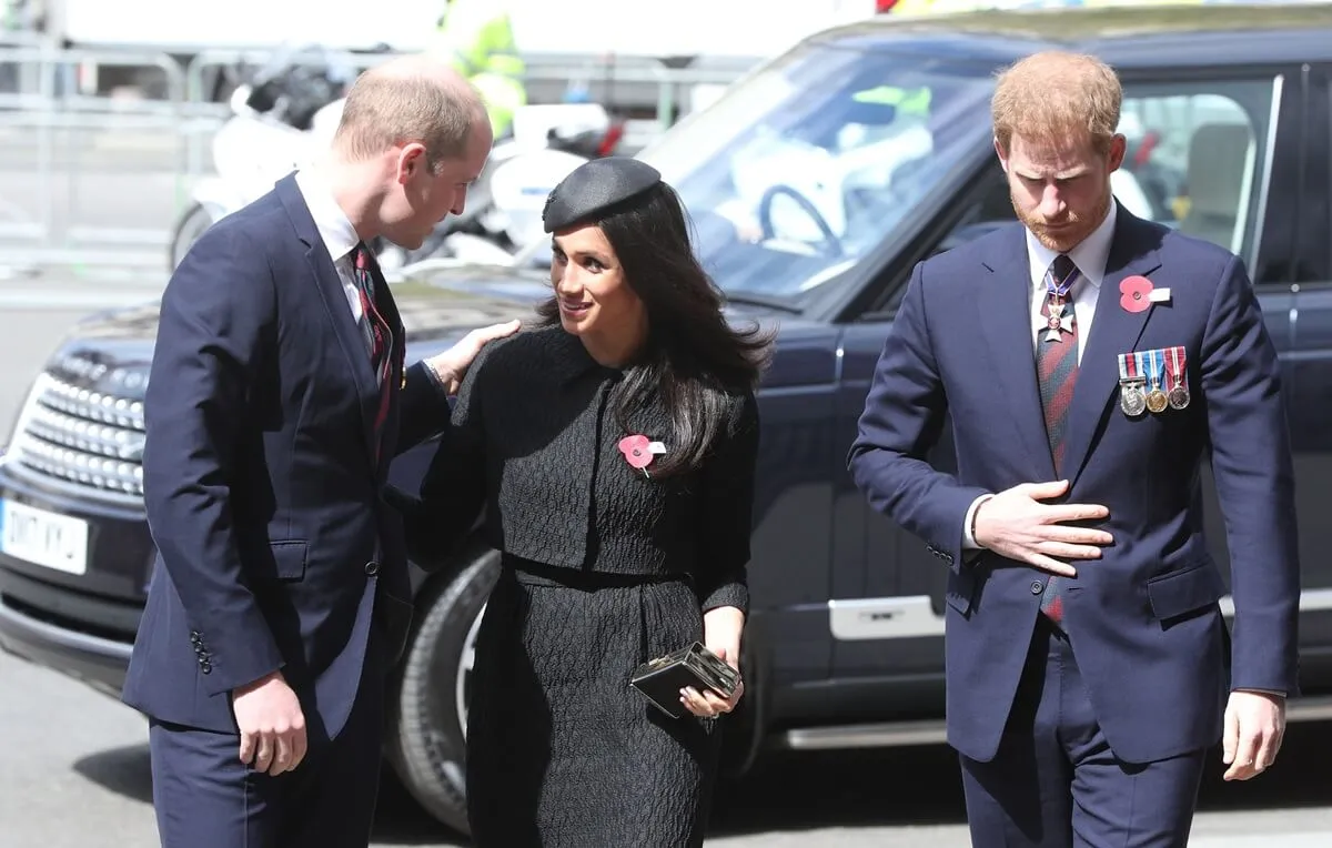 Prince William speaks with Meghan Markle as she and Prince Harry arrive for the annual Service of Commemoration and Thanksgiving at Westminster Abbey