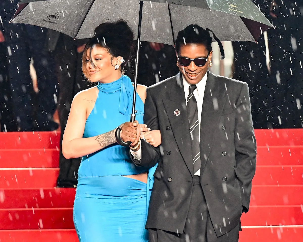 Rihanna and A$AP Rocky under an umbrella