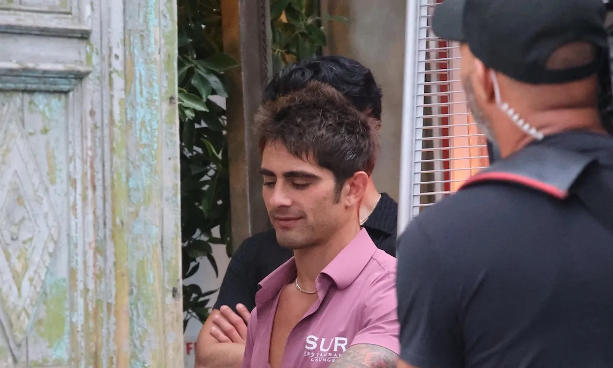 Man in pink shirt filming 'Vanderpump Rules' outside SUR in West Hollywood