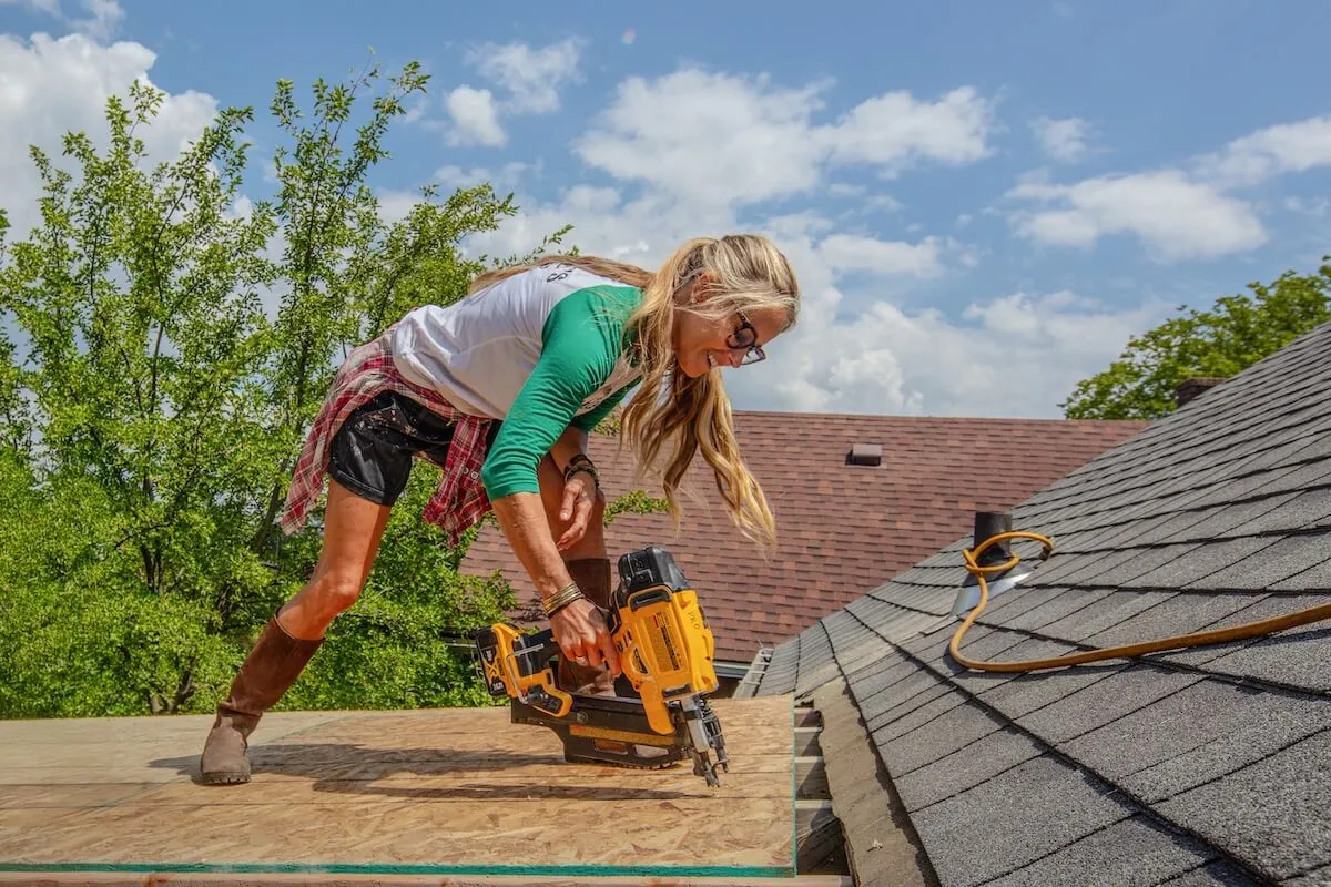 Nicole Curtis working on the roof of a home in the news season of 'Rehab Addict'