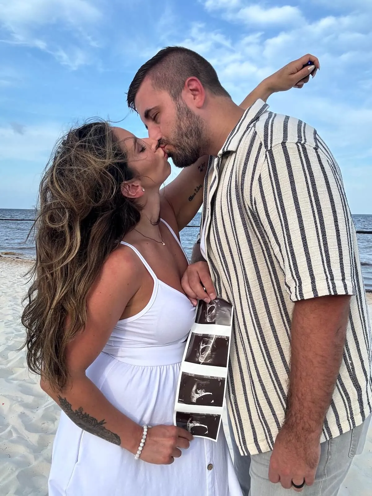 Nicole and Chris from 'Married at First Sight' Season 16 kiss as they show off ultrasound images