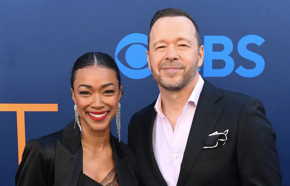 Smiling Sonequa Martin-Green and Donnie Wahlberg at an event in May 2025