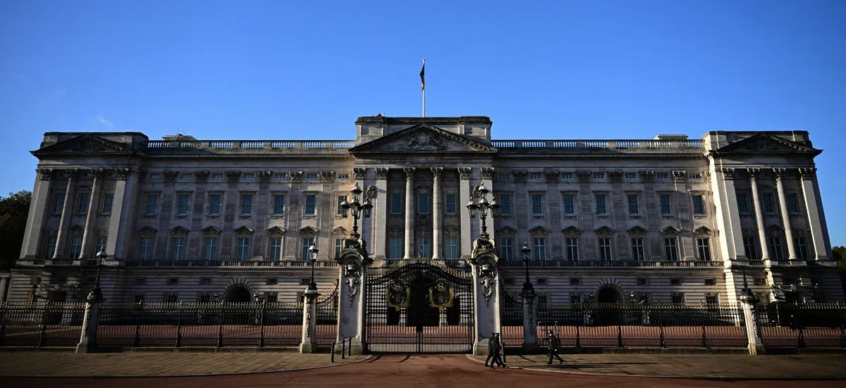 Police officers walk outside Buckingham Palace