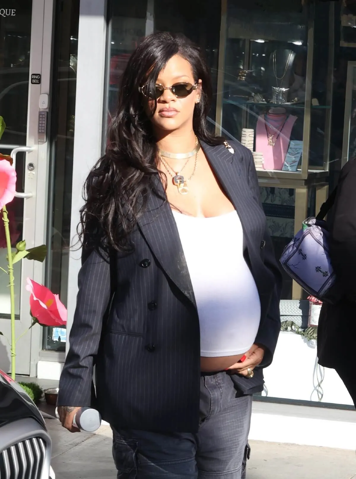 Pregnant Rihanna in a white top and black suit jacket in Beverly Hills