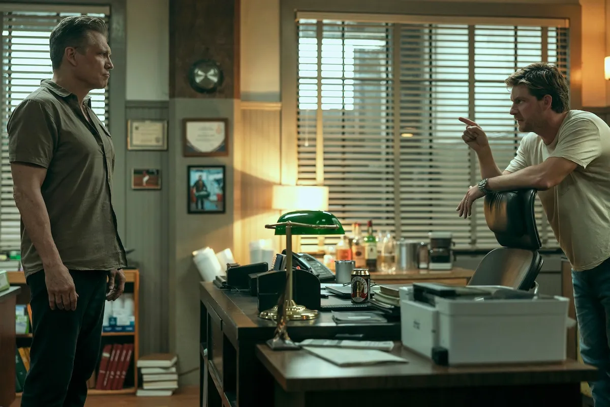A man in a white T-shirt angrily pointing at another man in 'The Waterfront' on Netflix