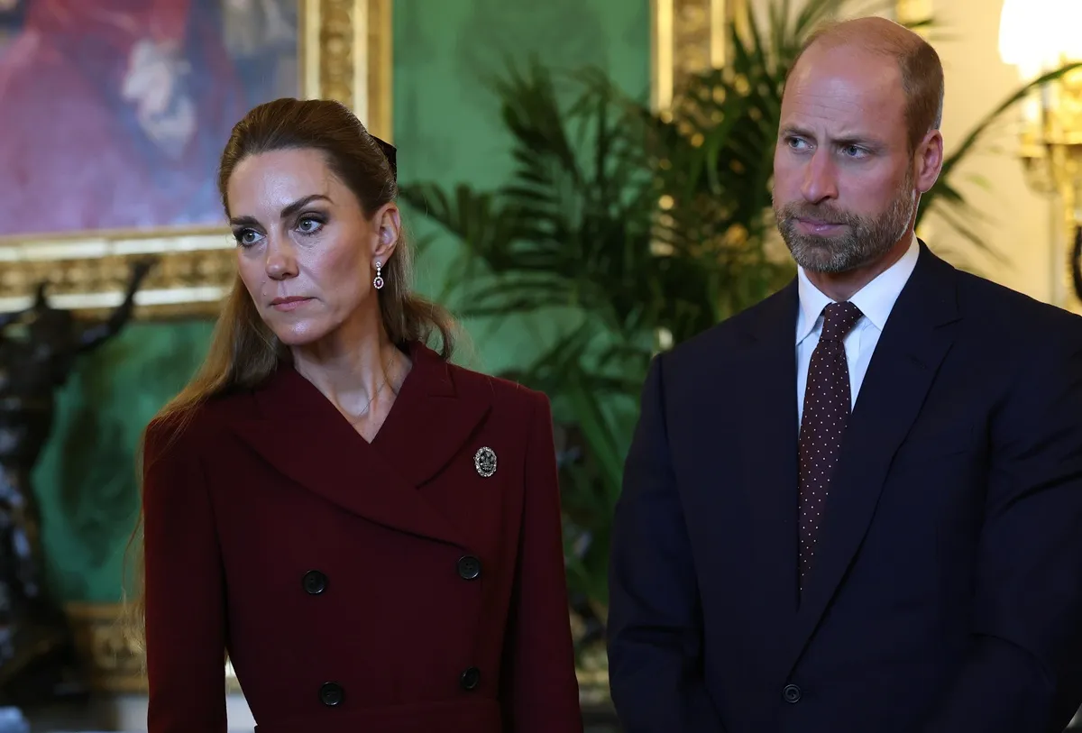Kate Middleton and William and Prince of Wales view items on display during a visit to the Royal Collection