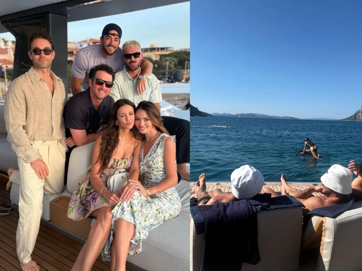 Smiling for a photo, Chace Crawford, a friend, Miles Teller, Nina Dobrev, Zac Efron, and Keleigh Teller sit on their boat together