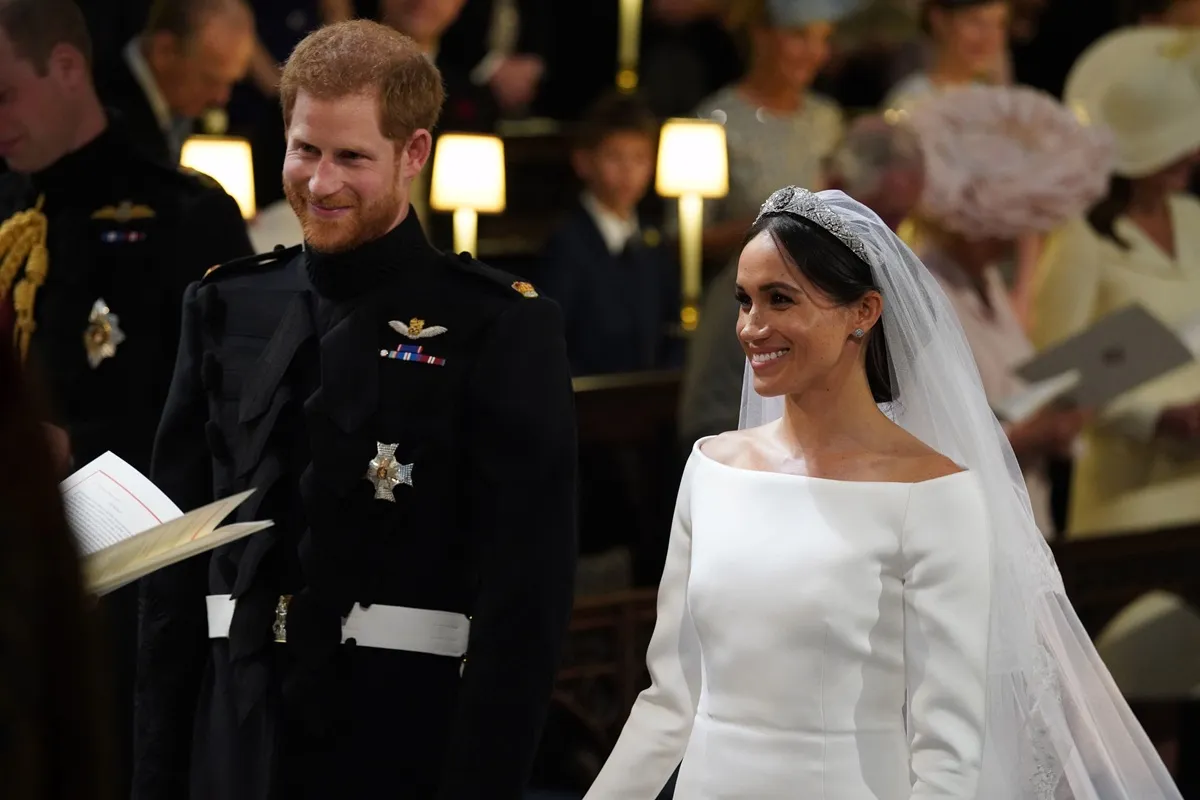 Prince Harry and Meghan Markle smiling on their wedding day