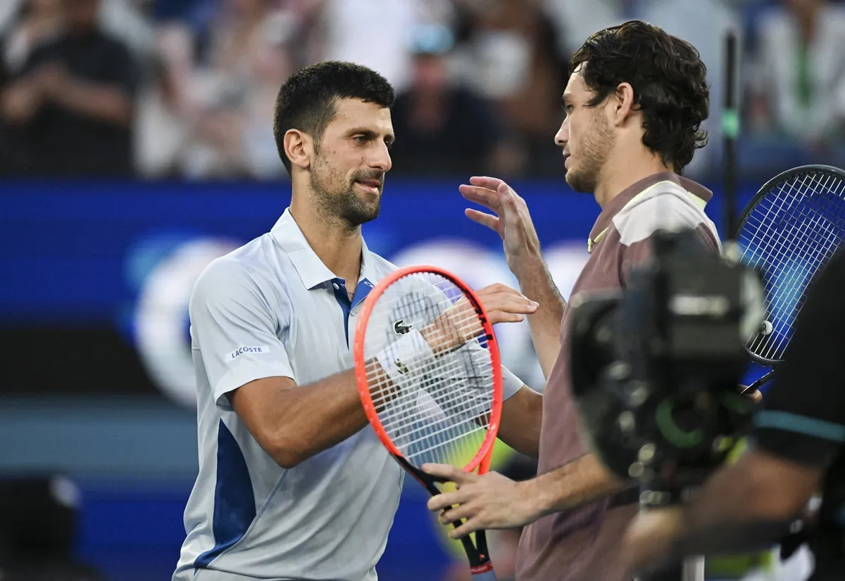 Serbia's Novak Djokovic shakes hands with USA's Taylor Fritz at the Australian Open