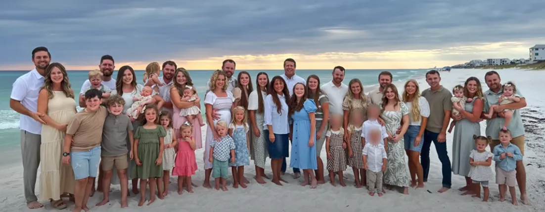 The Duggar family poses for a photo together during a beach getaway.