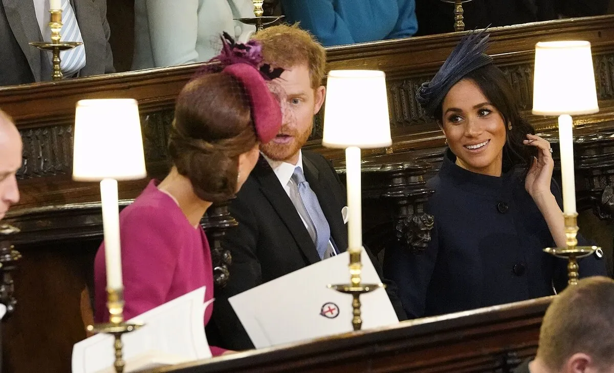 Kate Middleton, Prince Harry, and Meghan Markle during the wedding ceremony of Princess Eugenie and Jack Brooksbank