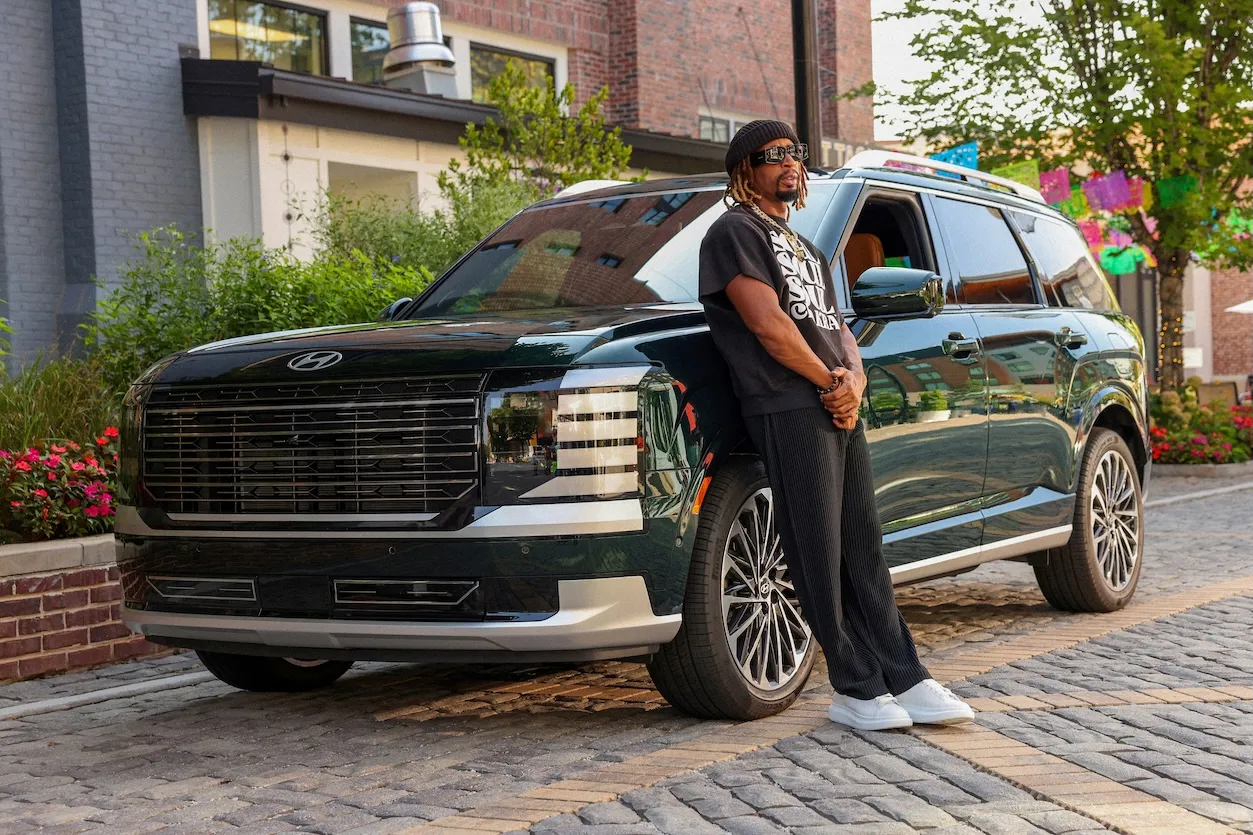 Lil Jon standing against a 2026 Hyundai Palisade Hybrid