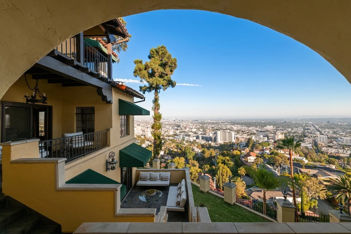 Balconies on a Spanish-style home with a view of Los Angeles in the background