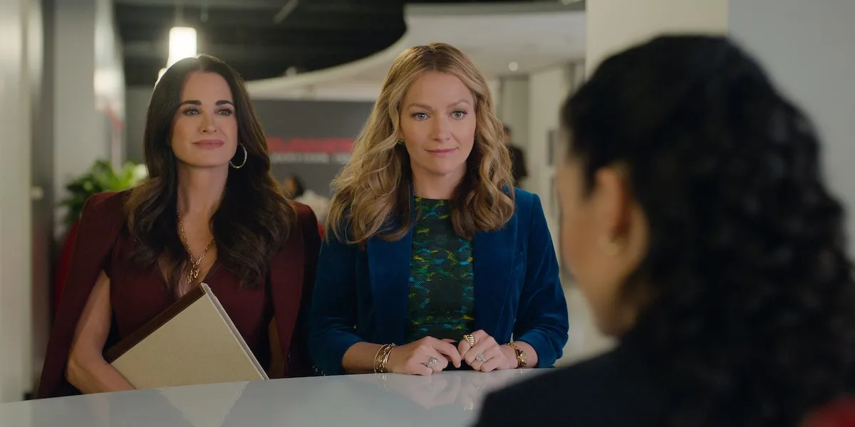 Kyle Richards and Becki Newton sitting next to each other in 'The Lincoln Lawyer' Season 4