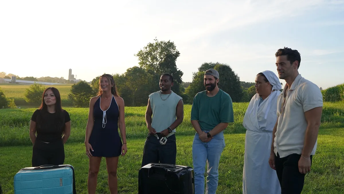 Group of people standing in front of a field in TLC's 'Suddenly Amish'