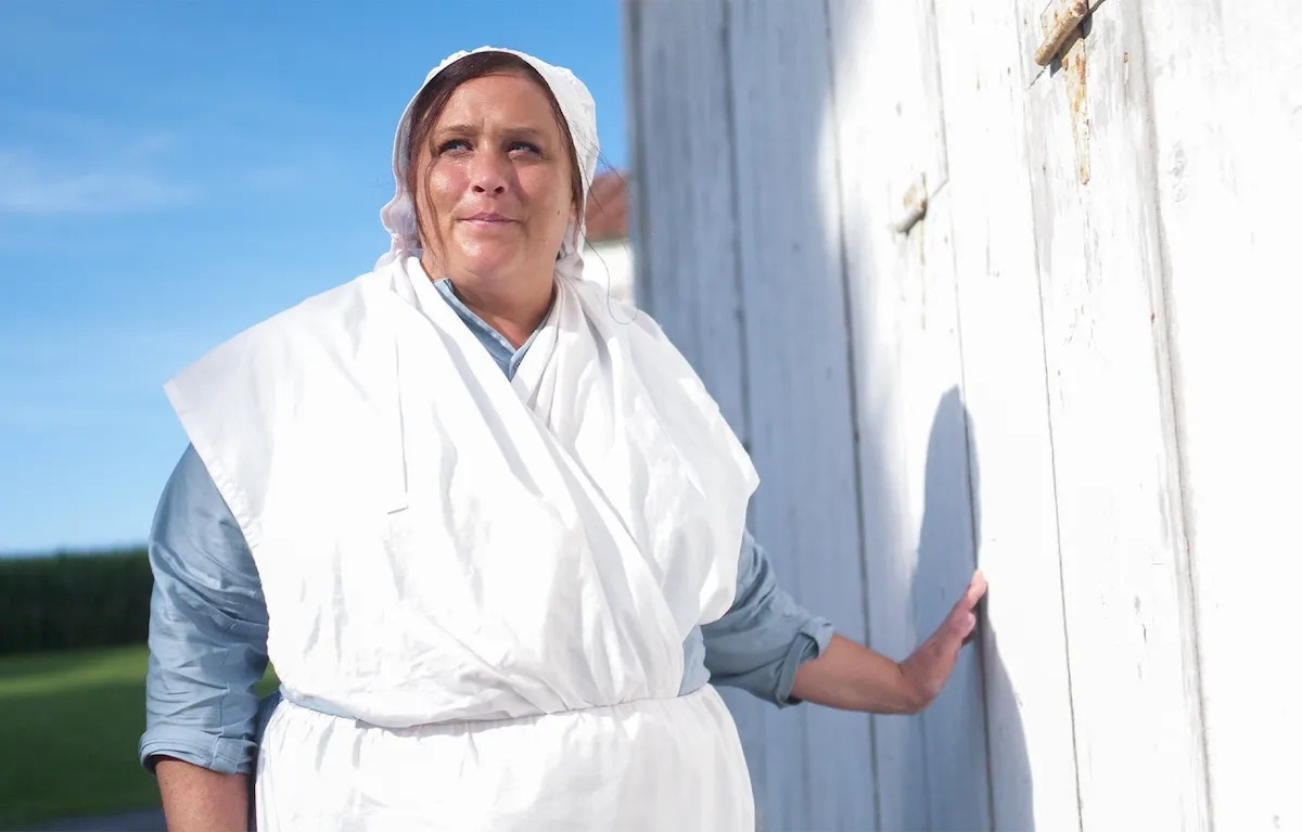Woman in traditional Amish dress in TLC's 'Suddenly Amish'
