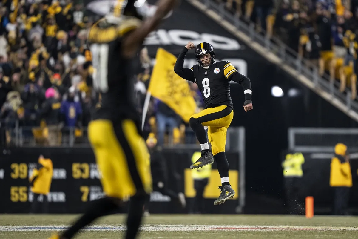Aaron Rodgers #8 of the Pittsburgh Steelers celebrates after a touchdown during an NFL football game against the Baltimore Ravens