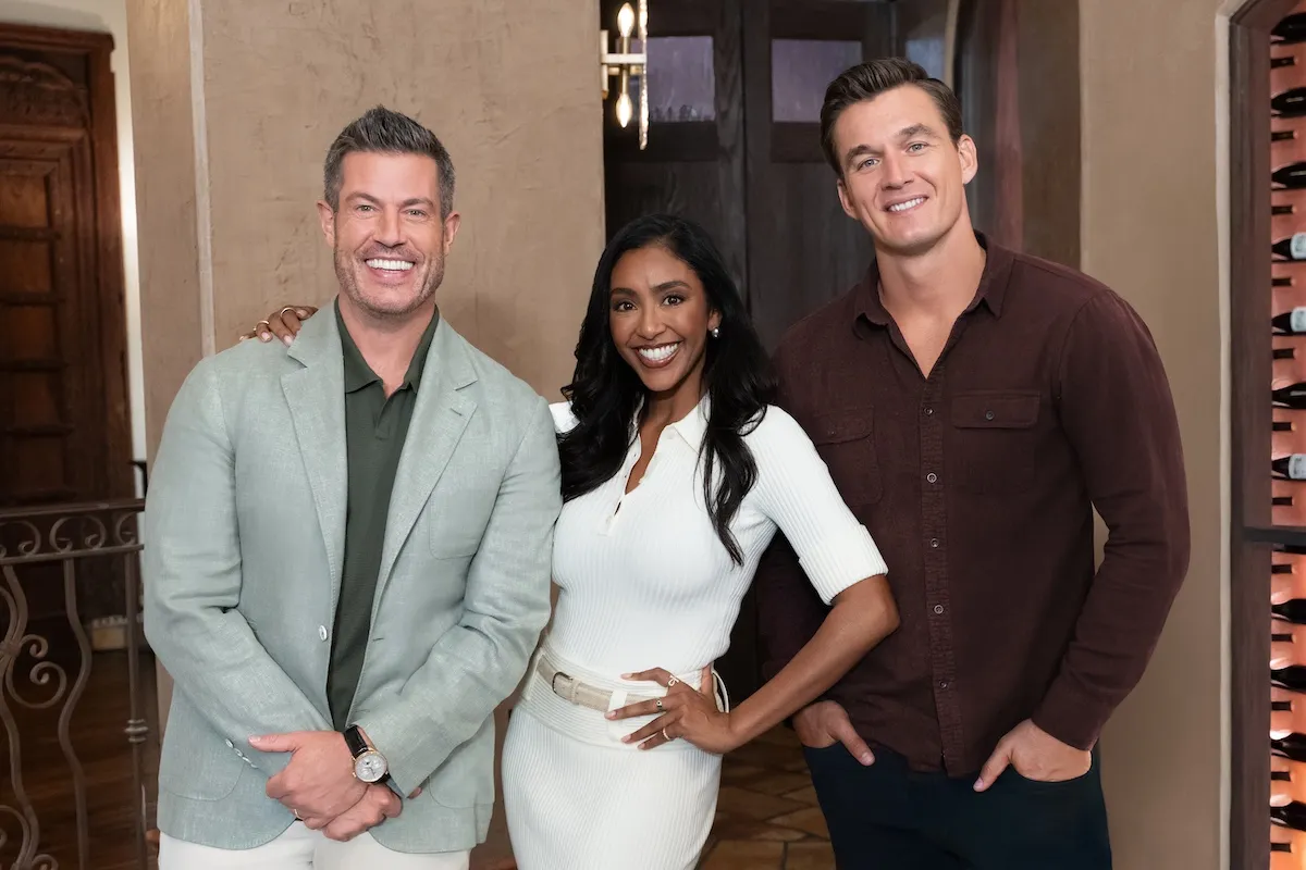 Jesse Palmer, Tayshia Adams, and Tyler Cameron pose for a photo