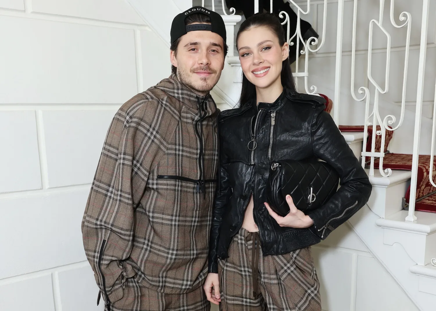 Brooklyn Beckham and Nicola Peltz Beckham posing in 2025