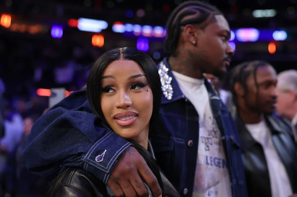 Stefon Diggs (R) and Cardi B (L) celebrate after Game Four of the Eastern Conference Second Round NBA Playoffs between the Boston Celtics and the New York Knicks