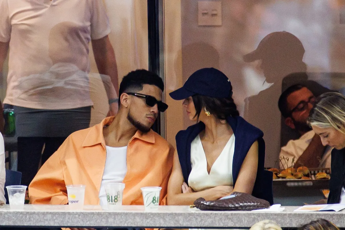 Kendall Jenner and Devin Booker watch Carlos Alcaraz of Spain against Casper Ruud of Norway in the final of the men's singles at the USTA Billie Jean King National Tennis Center on September 11, 2022