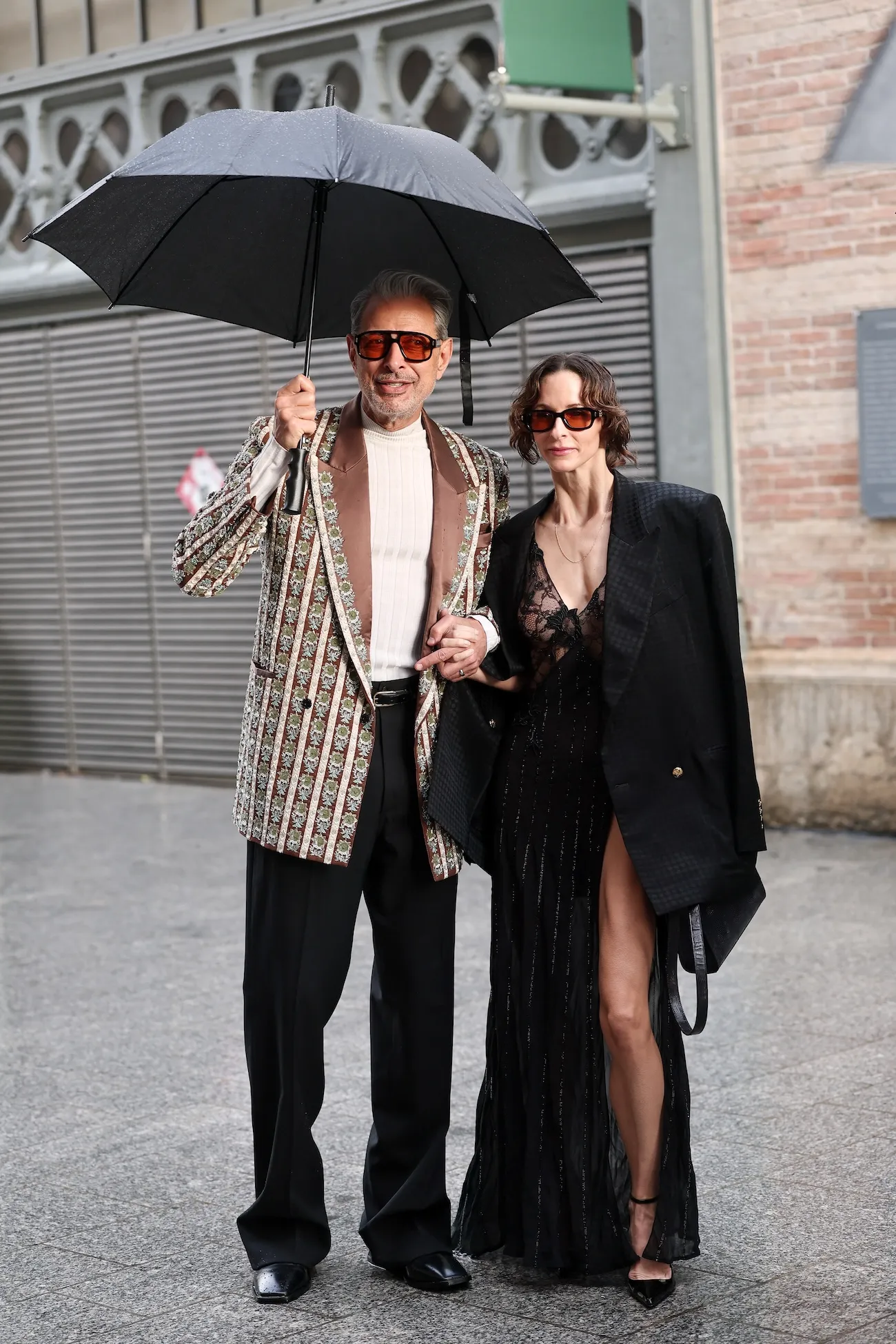 Jeff Goldblum and Emilie Livingston posing at Paris Fashion Week