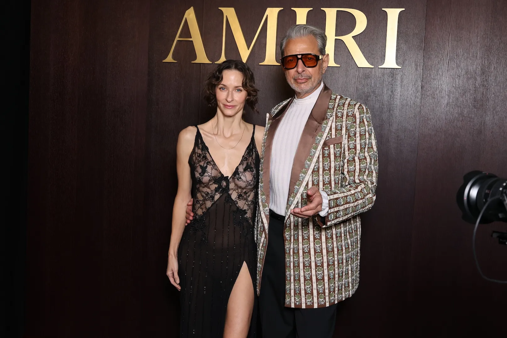 Jeff Goldblum and Emilie Livingston posing together at Fashion Week