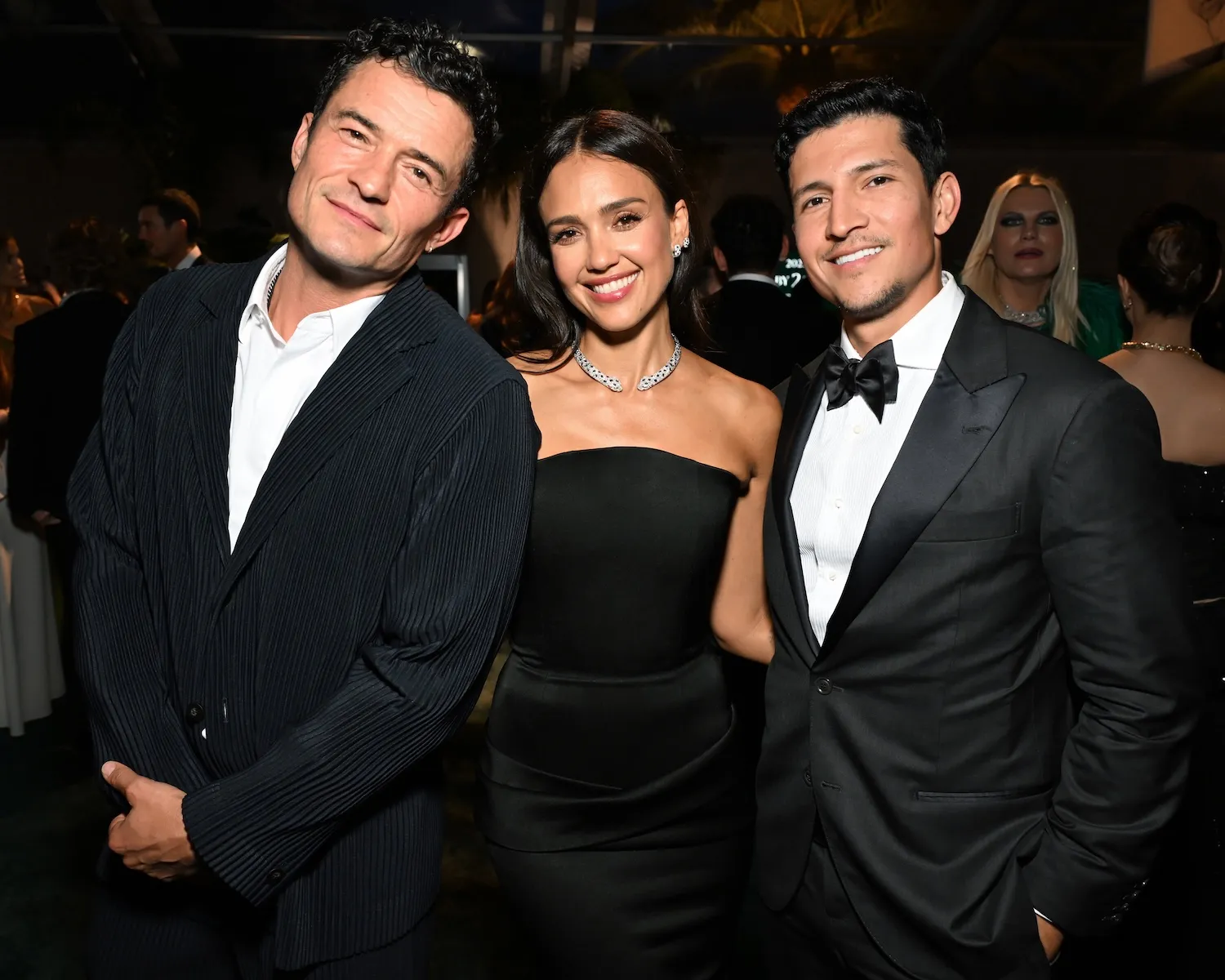 Jessica Alba, Orlando Bloom, and Danny Ramirez posing together in 2025