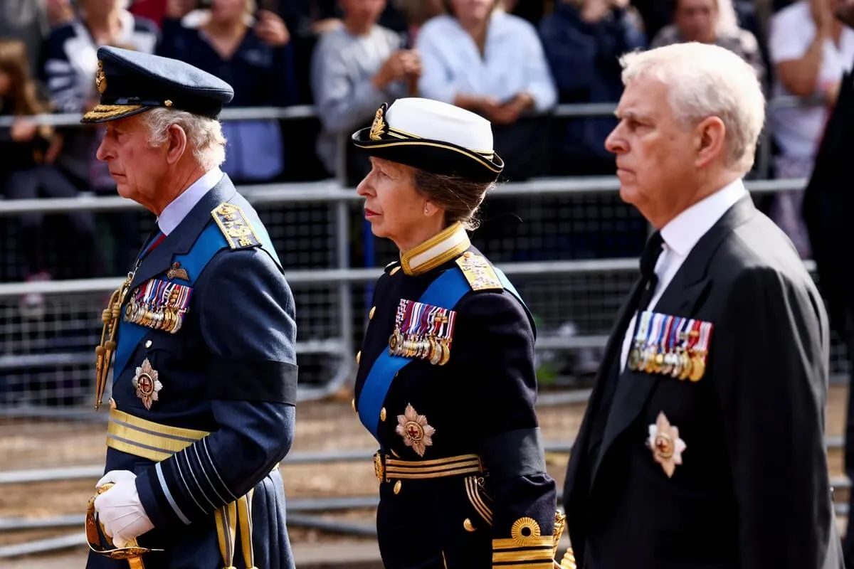 King Charles III, Princess Anne, and Andrew Mountbatten-Windsor walk behind the coffin during the procession for the Lying-in State of Queen Elizabeth II