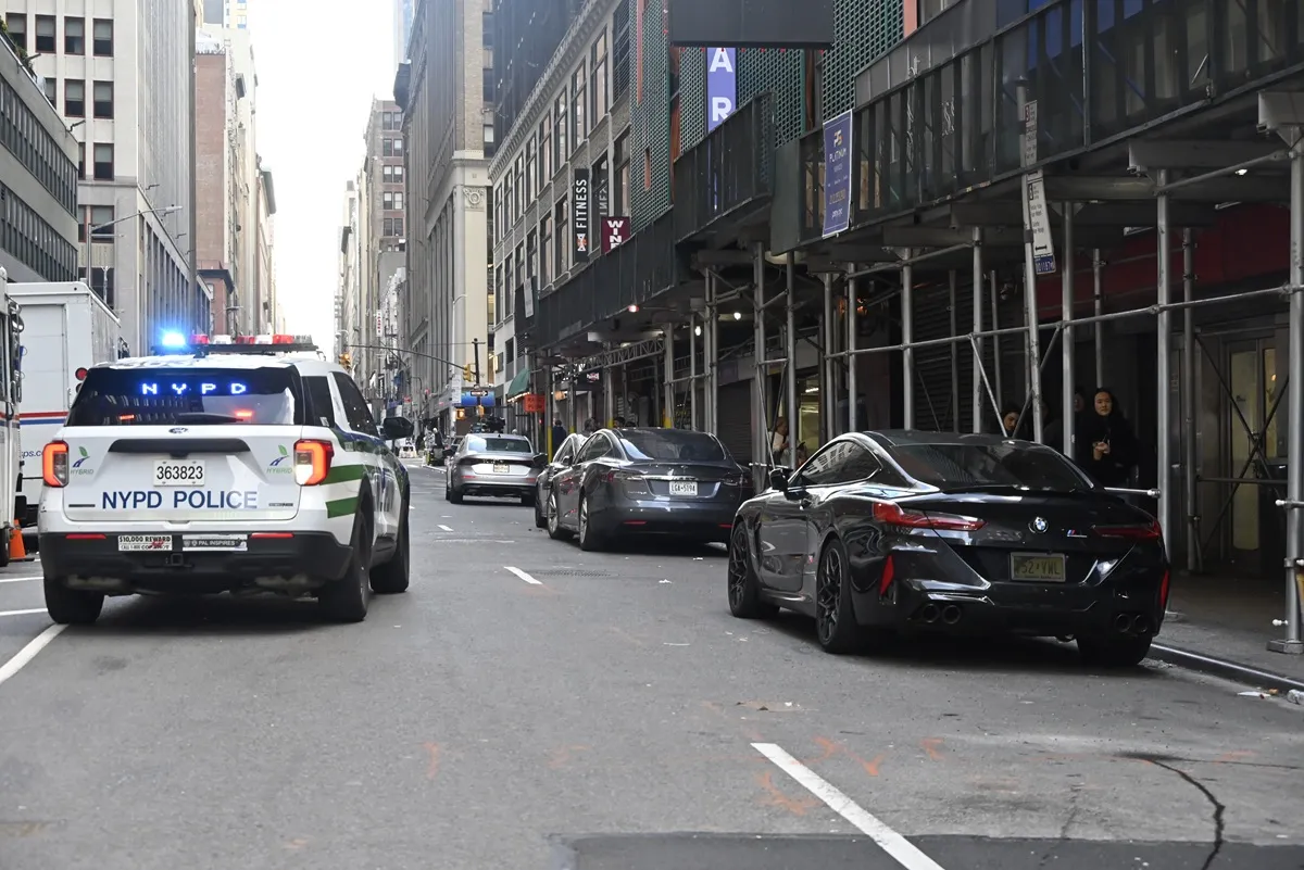 NYPD officers maintain a security cordon after New York Jets NFL cornerback Kris Boyd was shot and critically hurt outside a restaurant in Midtown, Manhattan, New York, United States on November 16, 2025.