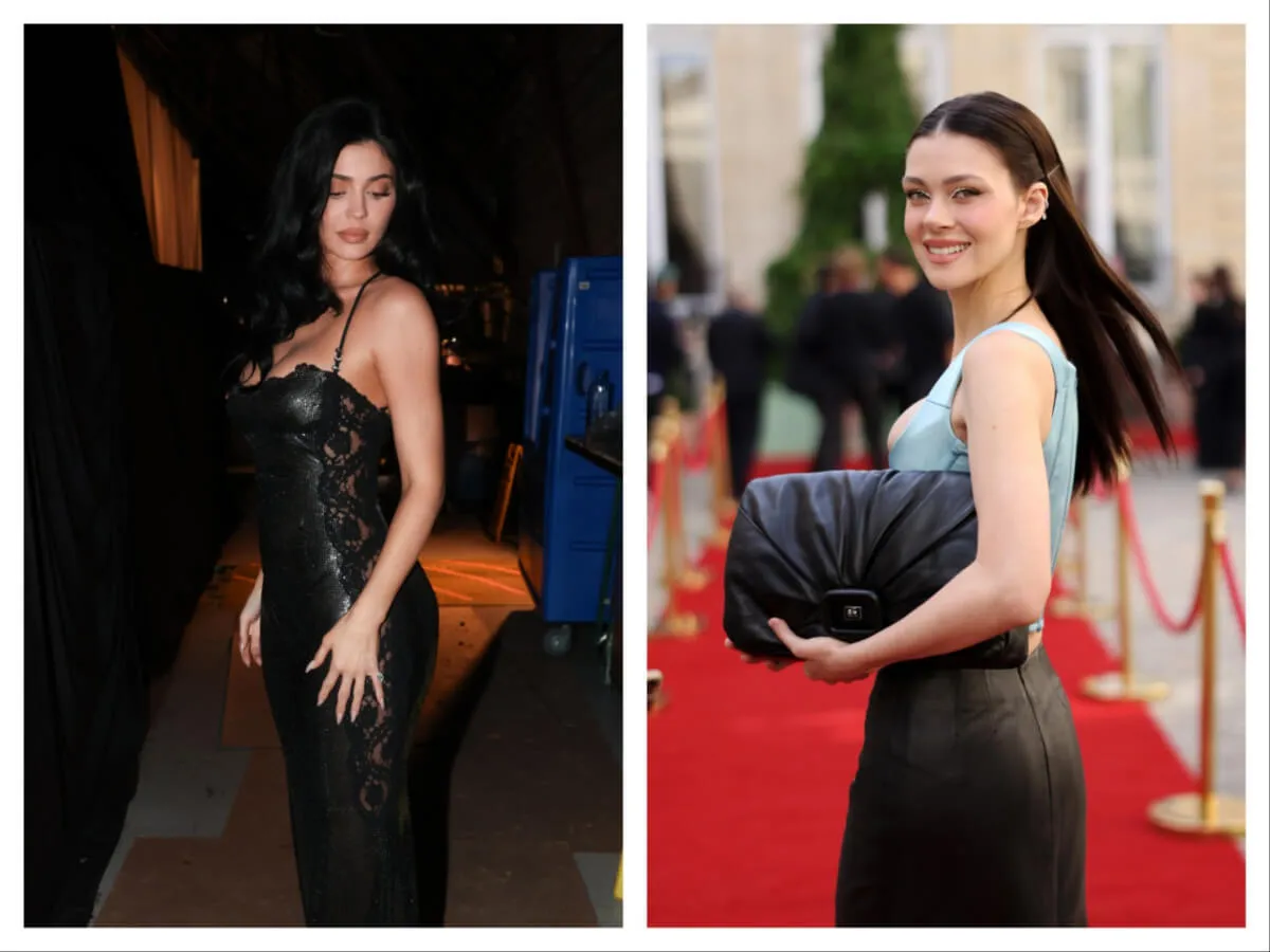 Kylie Jenner wears a black dress and stands on the red carpet. Nicola Peltz-Beckham wears a gray dress and holds a black bag while on the red carpet.